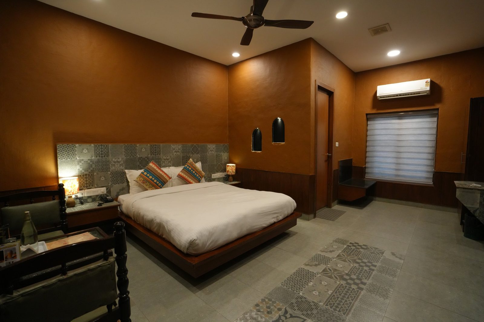 Hotel room with orange feature wall